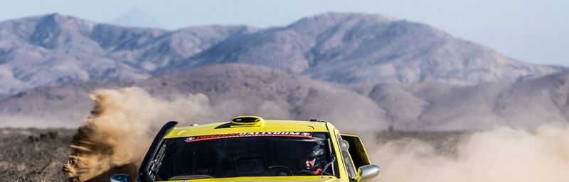 Rally raid buggy jumping over desert dunes in the Atacama, Chile (photo 17 of 36)