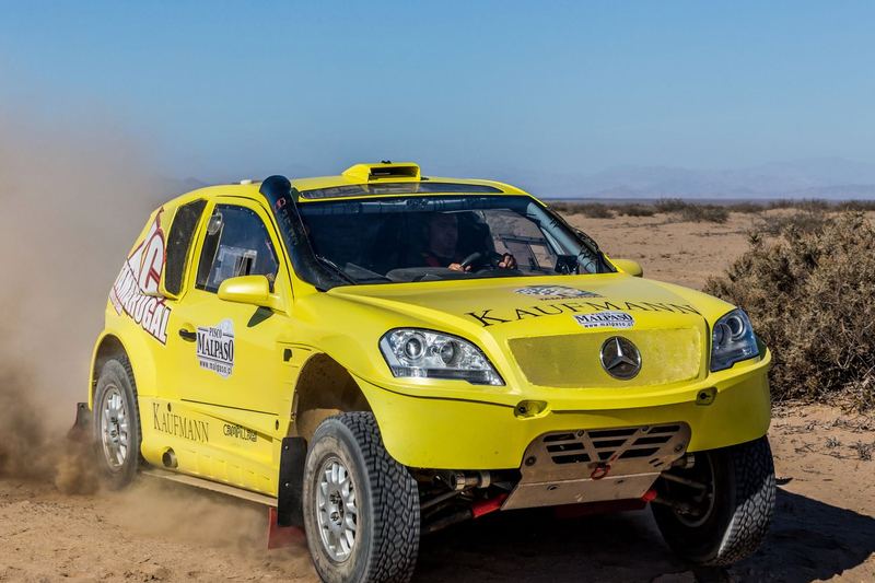 Rally raid buggy jumping over desert dunes in the Atacama, Chile (photo 20 of 36)