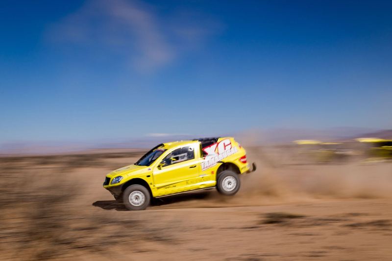 Rally raid buggy jumping over desert dunes in the Atacama, Chile (photo 31 of 36)