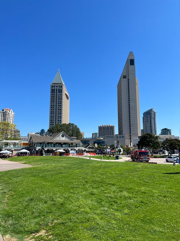 The twin towers of the San Diego Embarcadero rising behind a green park (photo 4 of 7)
