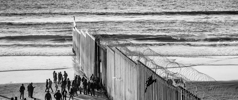 The border fence running into the Pacific at Playas de Tijuana at sunset (photo 2 of 17)