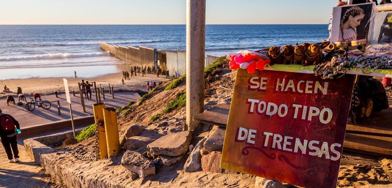 The border fence running into the Pacific at Playas de Tijuana at sunset (photo 5 of 17)